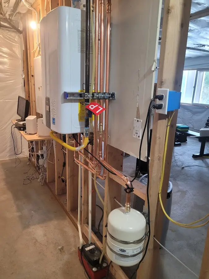 Licensed plumber repairing a kitchen sink in Ramsey